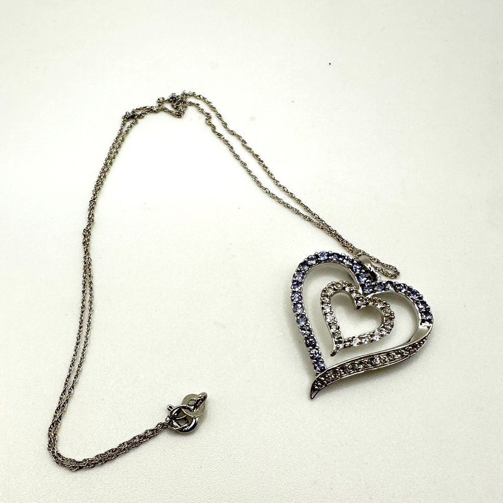 Genuine 1.5ctw tanzanite and CZ‎ accent heart necklace in sterling silver!